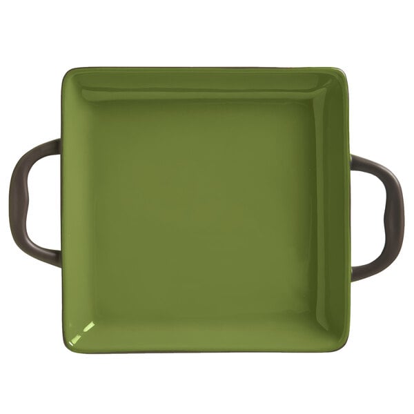 A green square Libbey stoneware baker with two handles.