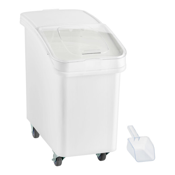 A white slant top mobile ingredient storage bin with a sliding lid and a scoop.