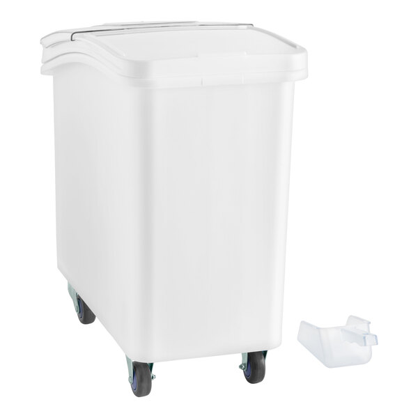 A white slant top mobile ingredient storage bin with a sliding lid and a scoop.