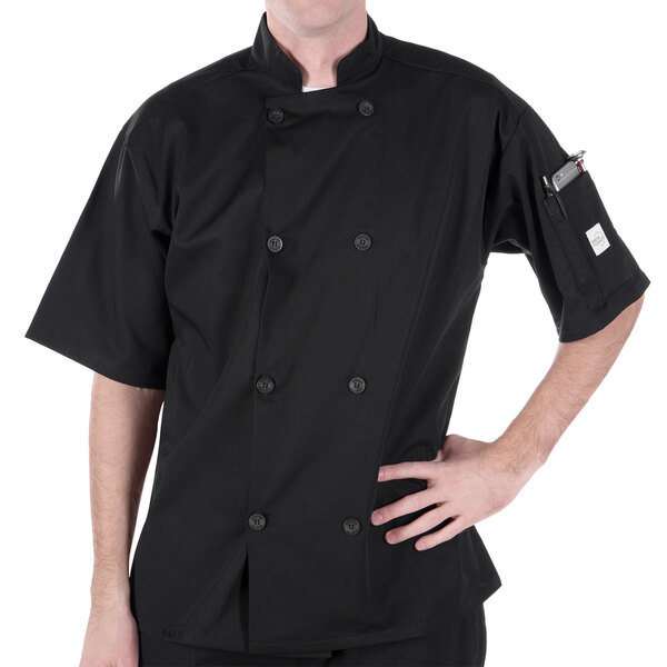 A man wearing a black Mercer Culinary chef coat.