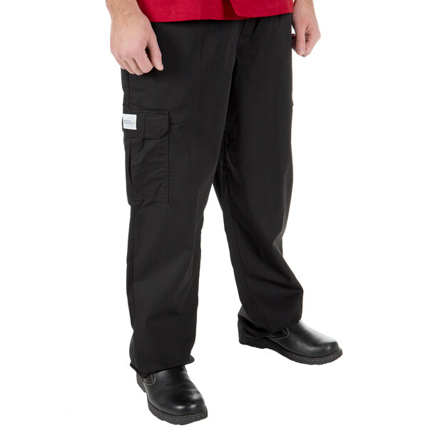 A person wearing Mercer Culinary black cargo pants.