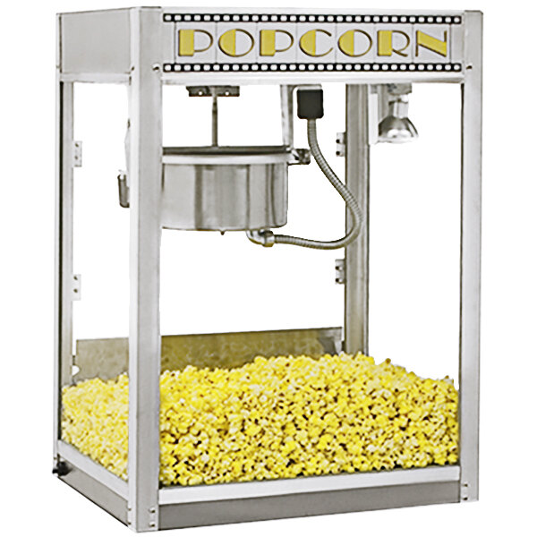 A Benchmark USA stainless steel popcorn machine with popcorn in it.
