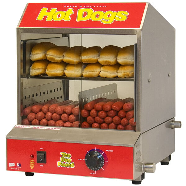 A Benchmark USA Dog Pound hot dog steamer with hot dogs and buns.
