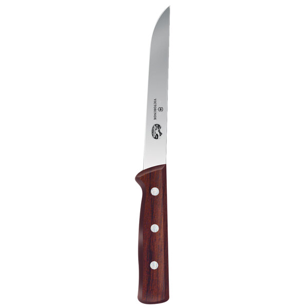 A Victorinox boning knife with a rosewood handle on a counter.