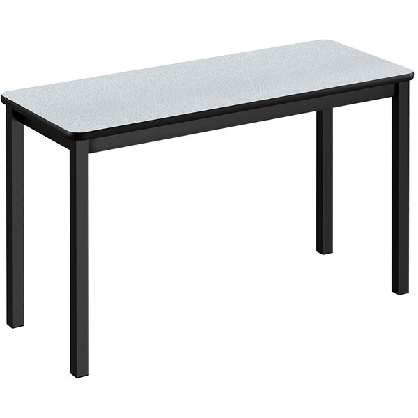 A white rectangular Correll lab table with black legs.