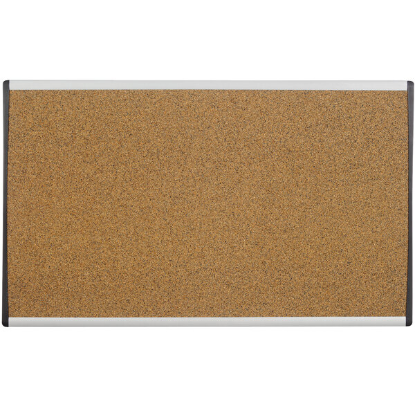A cork board with a tan aluminum frame.