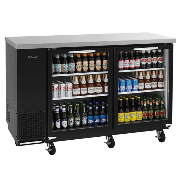 A Turbo Air back bar refrigerator with two glass doors filled with beer bottles.
