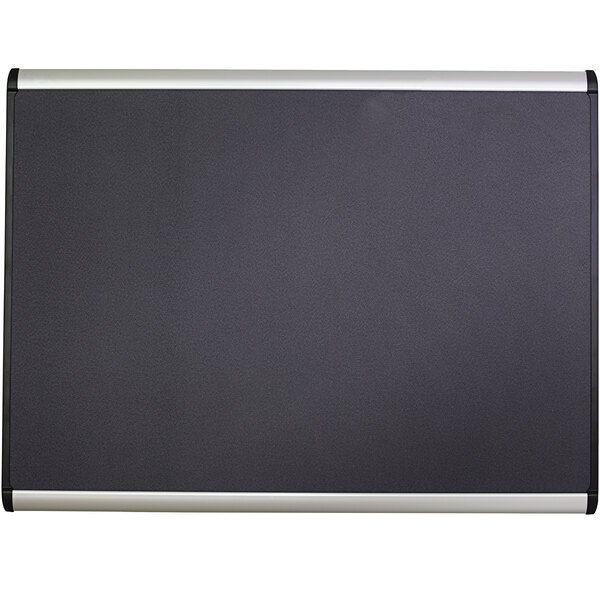 A black Quartet bulletin board with silver trim.