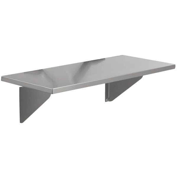 A stainless steel Advance Tabco stationary end shelf on a counter.