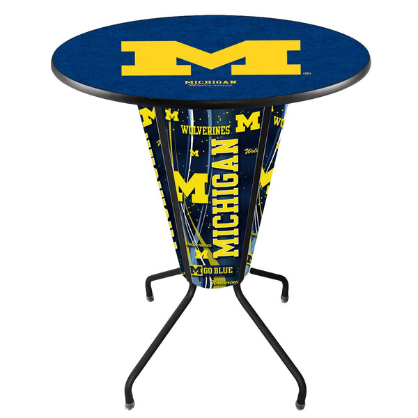 A Holland Bar Stool University of Michigan 36" round bar height pub table with a University of Michigan logo on it.