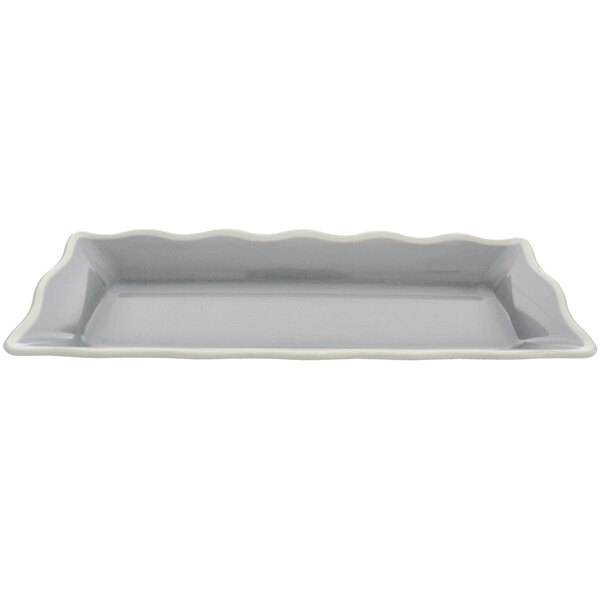 A rectangular gray melamine tray with a white wavy edge.