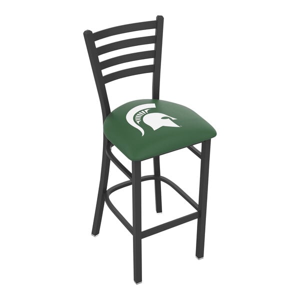 A black steel bar chair with a green padded seat and a white Michigan State University logo on the chair back.