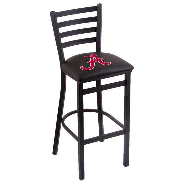 A black steel bar height chair with a black padded seat and ladder back featuring a red University of Alabama logo.