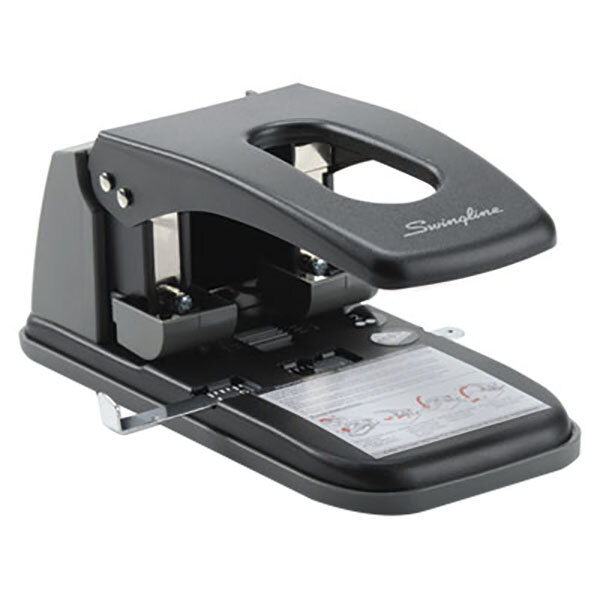 A black and gray Swingline 2 hole punch on a table.