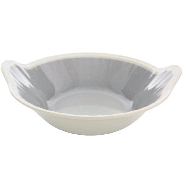 A white melamine bowl with a white surface and handles.