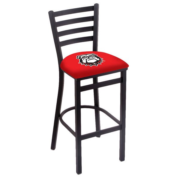 A black steel bar stool with a red padded seat and ladder back decorated with a red and black University of Georgia logo.