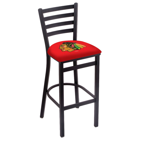 A black steel bar stool with a Chicago Blackhawks logo on the padded seat.