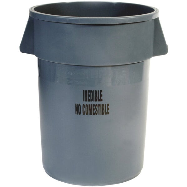 A grey Rubbermaid "Inedible" trash can with black text.