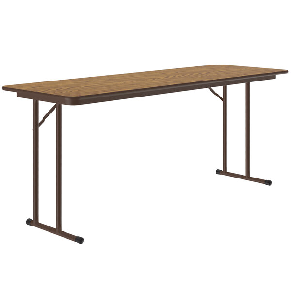 A brown rectangular Correll seminar table with a metal frame.