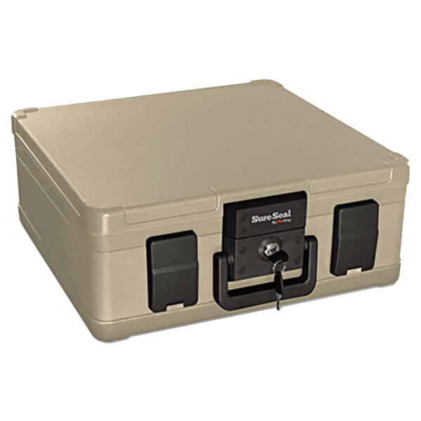A beige FireKing SureSeal fire and water chest with a black lock and key.