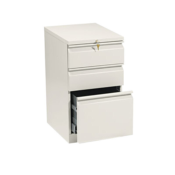A white HON mobile pedestal filing cabinet with three drawers.