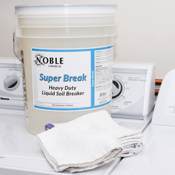 A white container of Noble Chemical Super Break Alkaline Laundry Soil Breaker.