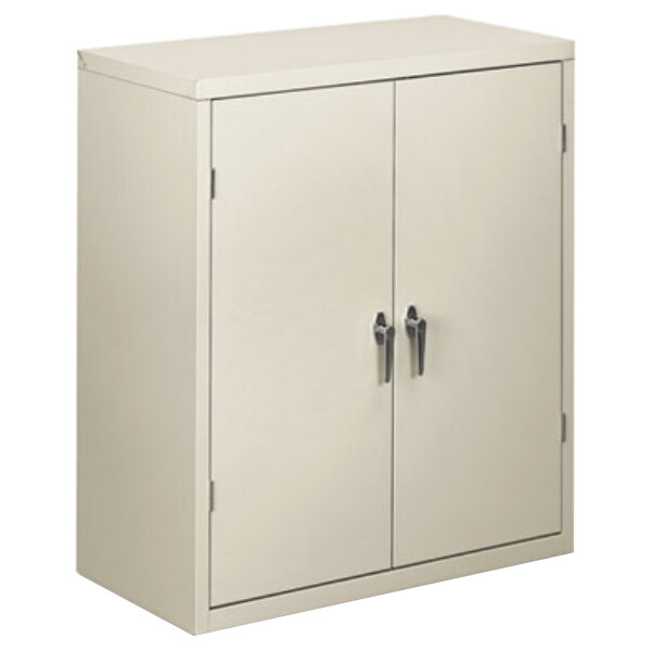 A light gray HON storage cabinet with two doors.