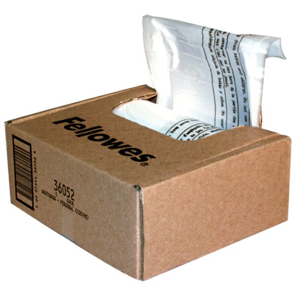 A brown box with a white bag of Fellowes 36052 shredder bags inside.