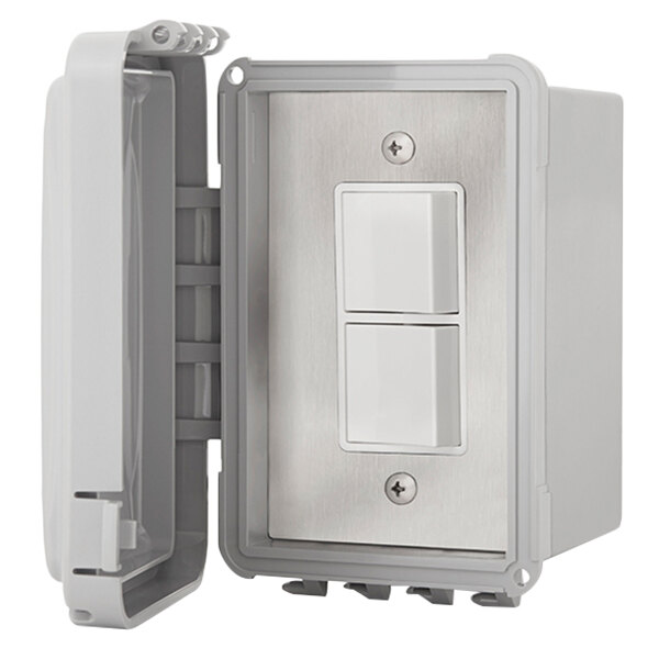 A white rectangular plastic box with two switches and a black weatherproof cover with a black handle.