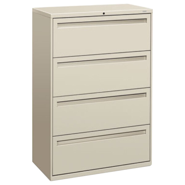 A light gray HON 700 Series file cabinet with four drawers.