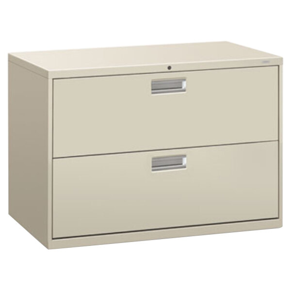 A light gray HON lateral filing cabinet with two drawers.