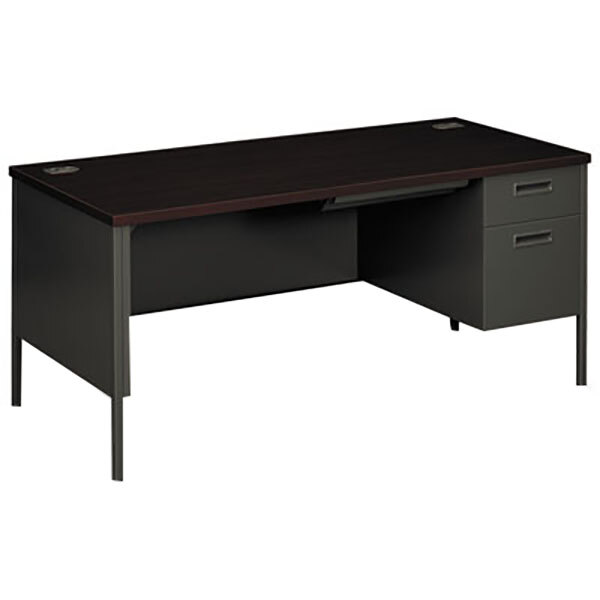 A dark brown Hon Metro Classic desk with a charcoal metal base.
