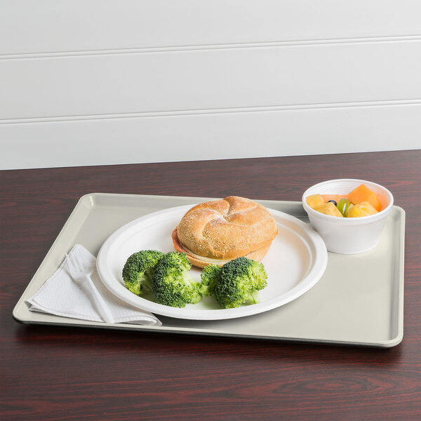A Cambro dietary tray with a plate of food and a cup of coffee on it.