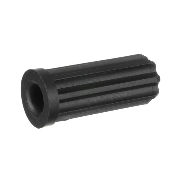 A black plastic cylinder with a small hole.