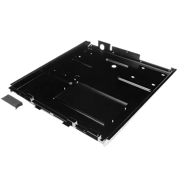 A black metal basepan gasket assembly with a piece of metal with holes.