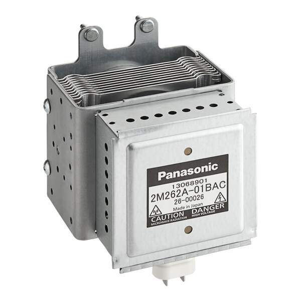 A metal square Amana magnetron with a black label.