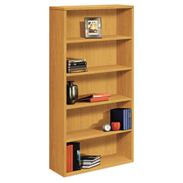 A HON laminate wood bookcase with books and objects on it.