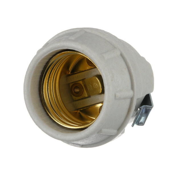 A white Vollrath lamp socket with a gold metal cover.