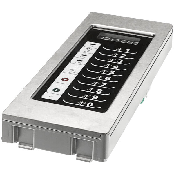 A silver rectangular Amana Control Assy with a metal keypad and buttons.