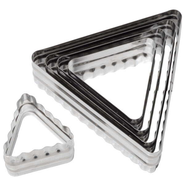 A set of Ateco stainless steel triangle cookie cutters.