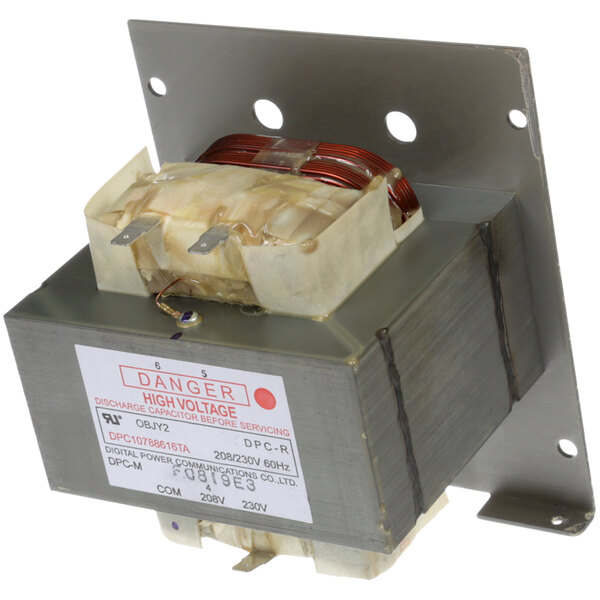 An Amana transformer in a small metal box with wires inside.