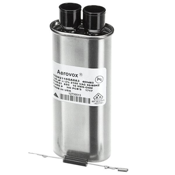 A silver metal Amana capacitor with black and white wires.