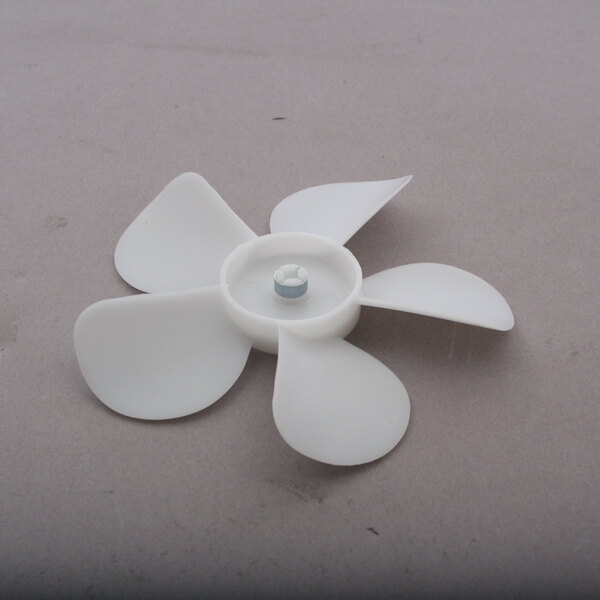 A white plastic Hobart fan blade.