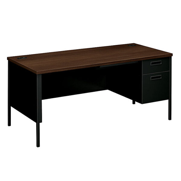 A mahogany desk with a charcoal metal right pedestal with drawers.