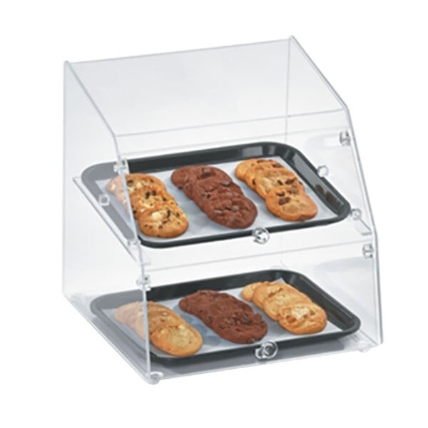 A Vollrath small classic acrylic bakery display case with trays of cookies and a chocolate chip cookie.