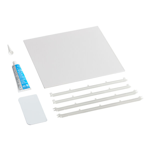 A white square Amana tray kit with a blue and white tube of glue and a white tube of glue.