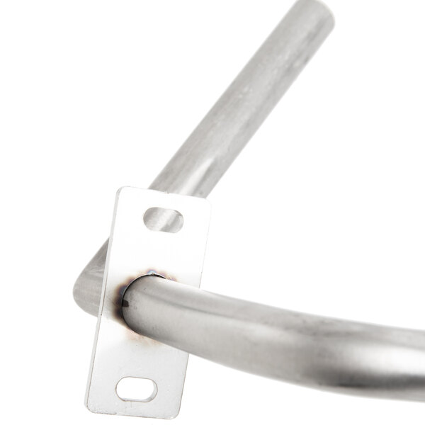 A metal pole with a square hole in it.