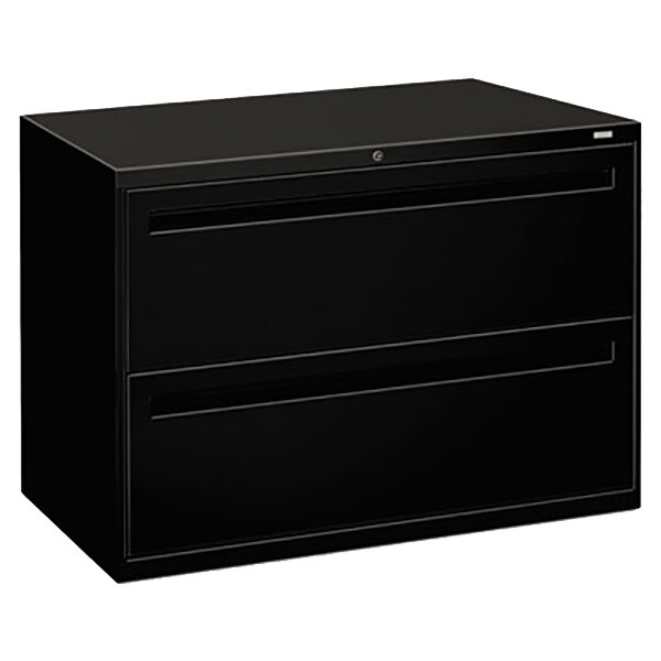 A black rectangular HON metal file cabinet with two drawers and a silver line.