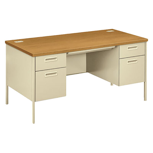 A HON Metro Classic double pedestal desk with a wooden top and drawers on it.