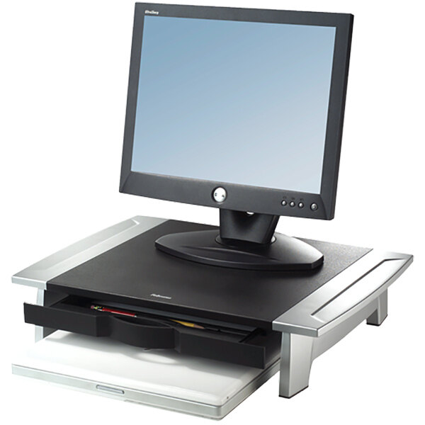 A Fellowes monitor riser holding a computer monitor.